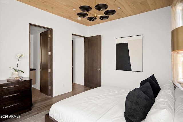 bedroom featuring wooden ceiling and dark wood-type flooring