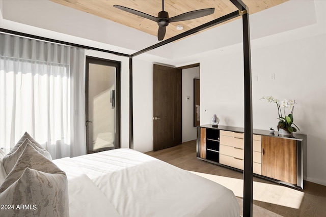 bedroom with wood ceiling, ceiling fan, and dark wood-type flooring