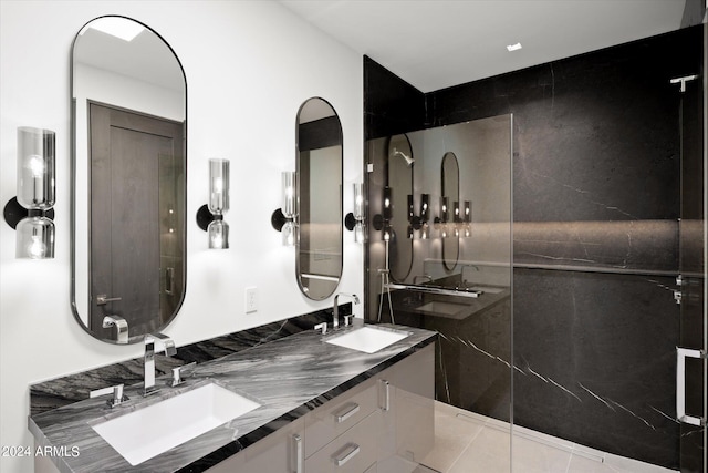 bathroom with a shower with door, tile floors, and dual bowl vanity