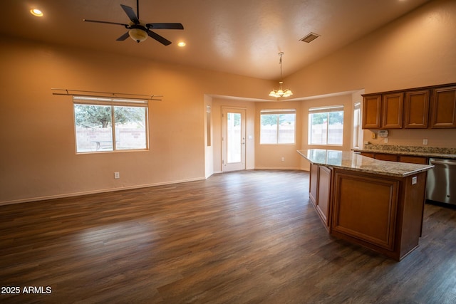 kitchen with visible vents, a kitchen island, open floor plan, dishwasher, and ceiling fan with notable chandelier