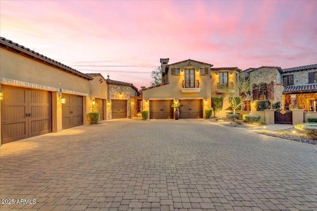 10935 E Grandview Way, Scottsdale, AZ 85255 - mediterranean / spanish-style home with a garage, decorative driveway, and stucco siding