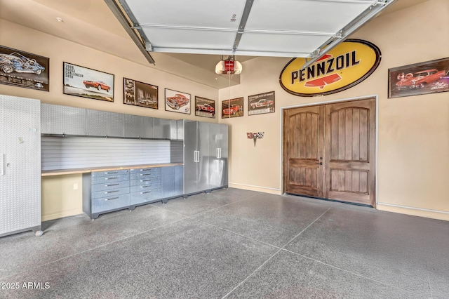 10935 E Grandview Way, Scottsdale, AZ 85255 - garage with baseboards and a garage door opener