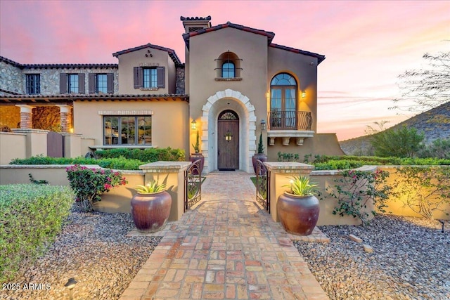 10935 E Grandview Way, Scottsdale, AZ 85255 - mediterranean / spanish-style home with a tiled roof, fence, a balcony, and stucco siding