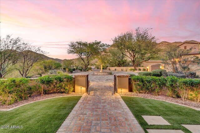 10935 E Grandview Way, Scottsdale, AZ 85255 - exterior space with a gate, fence, a yard, a mountain view, and stucco siding