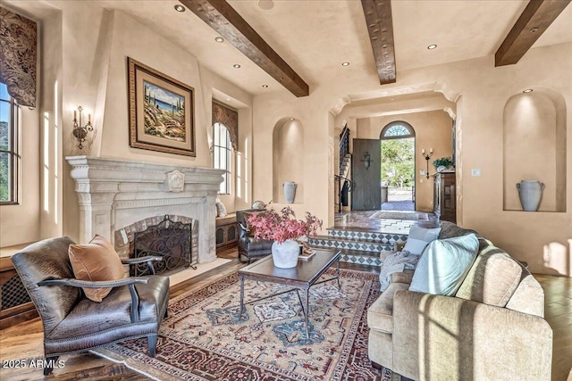 10935 E Grandview Way, Scottsdale, AZ 85255 - living area featuring a fireplace with flush hearth, recessed lighting, beamed ceiling, and wood finished floors