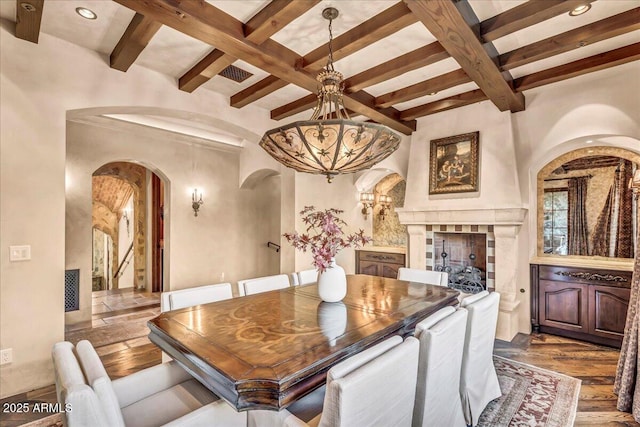 10935 E Grandview Way, Scottsdale, AZ 85255 - dining space featuring arched walkways, coffered ceiling, beamed ceiling, and an inviting chandelier