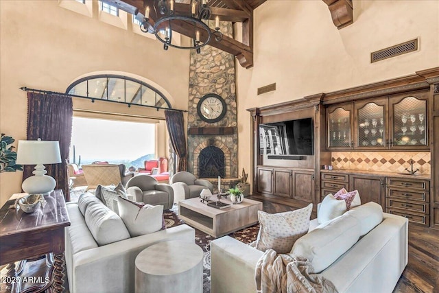 10935 E Grandview Way, Scottsdale, AZ 85255 - living area featuring dark wood-type flooring, visible vents, and a towering ceiling
