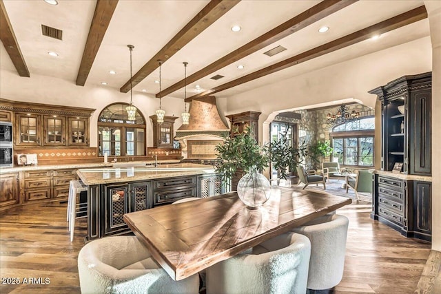 10935 E Grandview Way, Scottsdale, AZ 85255 - dining space with visible vents, beamed ceiling, and wood finished floors