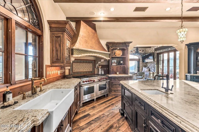 10935 E Grandview Way, Scottsdale, AZ 85255 - kitchen with dark wood-type flooring, double oven range, a sink, and custom exhaust hood