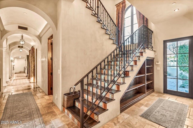 10935 E Grandview Way, Scottsdale, AZ 85255 - interior space with arched walkways, high vaulted ceiling, recessed lighting, visible vents, and stone tile flooring