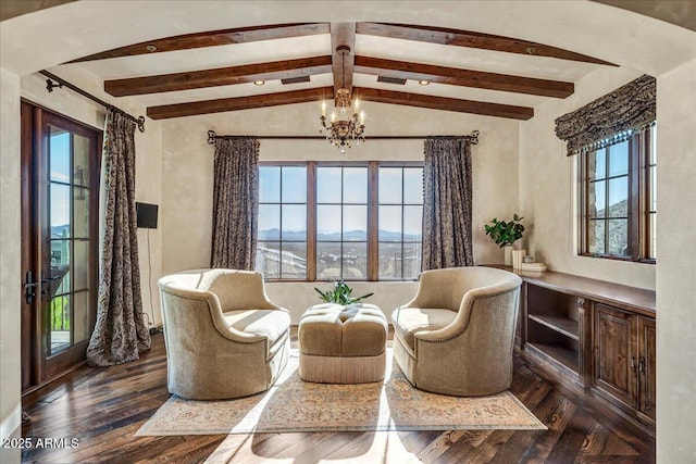 10935 E Grandview Way, Scottsdale, AZ 85255 - living area featuring lofted ceiling with beams, dark wood-style flooring, and an inviting chandelier
