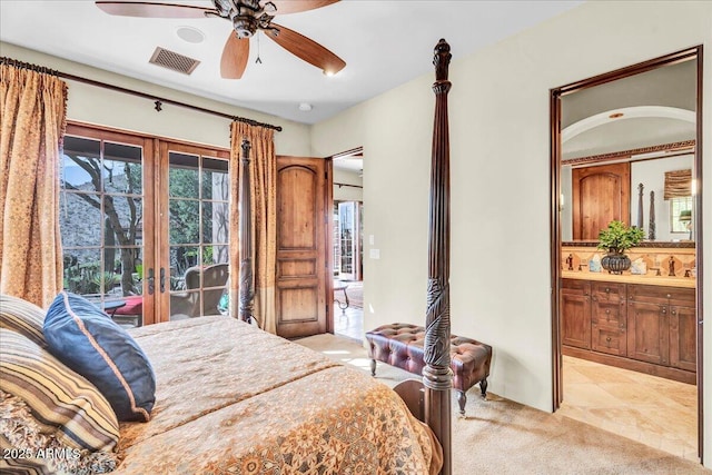 10935 E Grandview Way, Scottsdale, AZ 85255 - bedroom with ensuite bathroom, light carpet, a sink, visible vents, and access to exterior