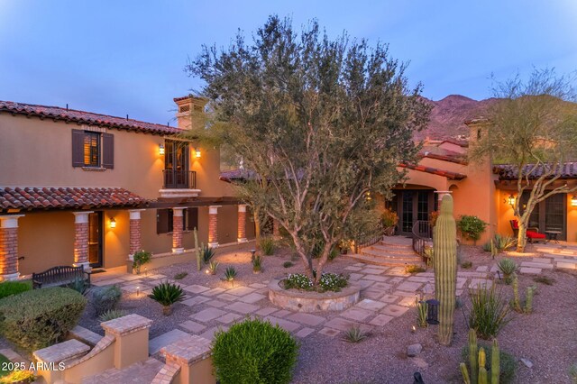 10935 E Grandview Way, Scottsdale, AZ 85255 - rear view of property with a tile roof, a mountain view, a chimney, and stucco siding