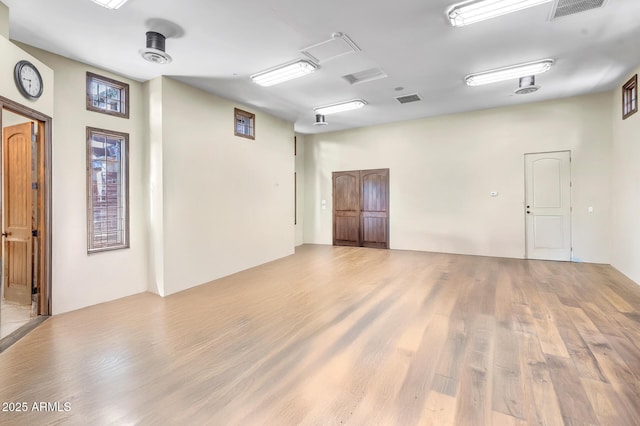 10935 E Grandview Way, Scottsdale, AZ 85255 - spare room featuring visible vents and wood finished floors