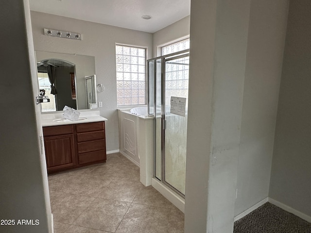 bathroom featuring vanity and separate shower and tub