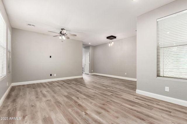 unfurnished room with ceiling fan and light hardwood / wood-style floors