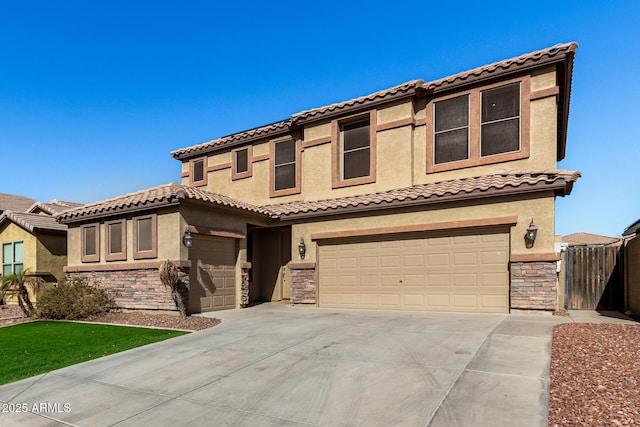 mediterranean / spanish-style house with a garage