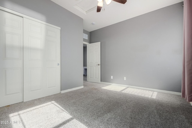 unfurnished bedroom with carpet, ceiling fan, and a closet