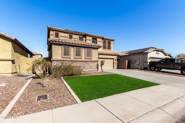 mediterranean / spanish-style home with a garage, a front lawn, and solar panels