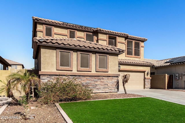 mediterranean / spanish-style house with a garage