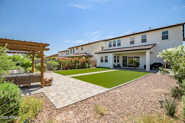 19736 W Turney Ave, Litchfield Park, AZ 85340 - back of house featuring a patio area, stucco siding, an outdoor hangout area, a pergola, and a fenced backyard