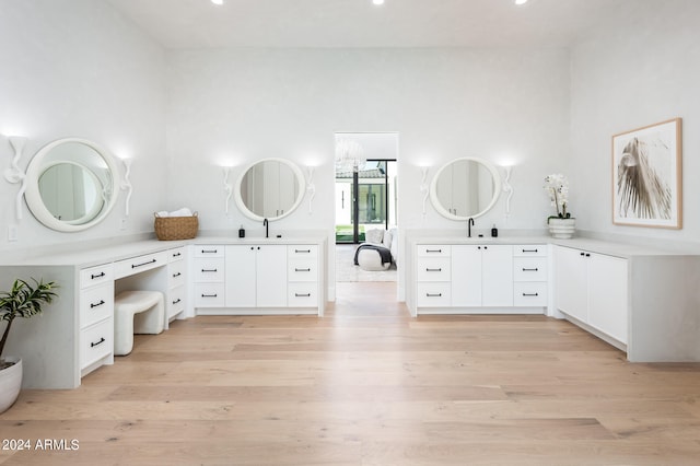 bathroom featuring wood-type flooring and vanity