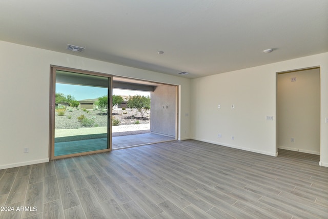 empty room with light hardwood / wood-style floors