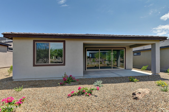 rear view of property with a patio area