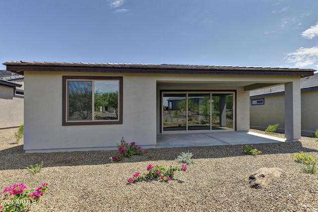 4320 Sawbuck Way, Wickenburg, AZ 85390 - back of house featuring a patio and stucco siding