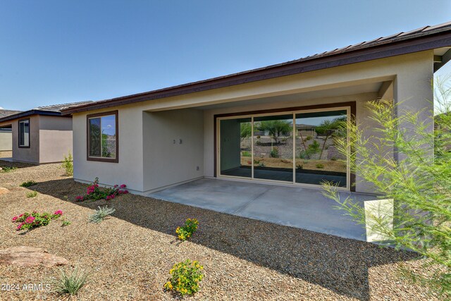 back of property featuring a patio area