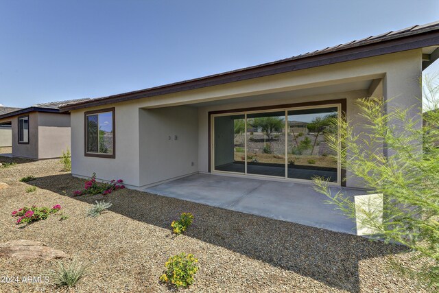 4320 Sawbuck Way, Wickenburg, AZ 85390 - back of house with a patio and stucco siding