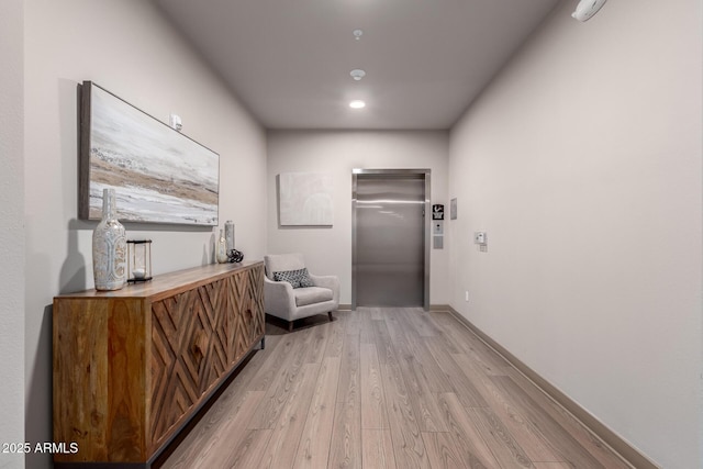 2511 W Queen Creek Rd Unit 174, Chandler, AZ 85248 - hall with elevator, light wood-type flooring, baseboards, and recessed lighting