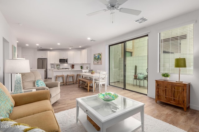 2511 W Queen Creek Rd Unit 174, Chandler, AZ 85248 - living room featuring light wood-style flooring, recessed lighting, and a ceiling fan