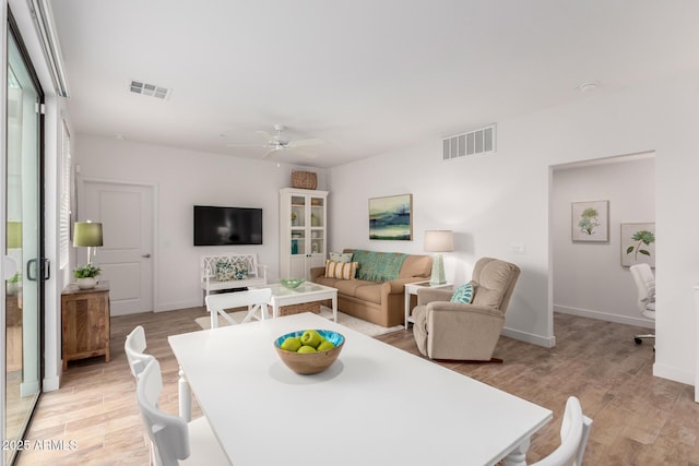 2511 W Queen Creek Rd Unit 174, Chandler, AZ 85248 - dining area with light wood-style floors, ceiling fan, and baseboards
