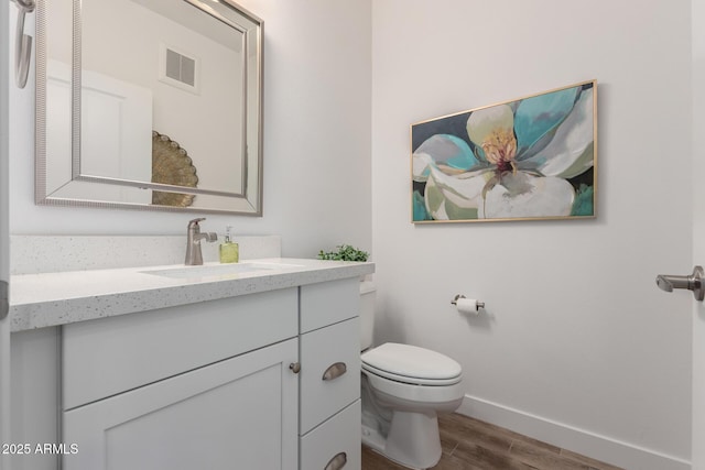 2511 W Queen Creek Rd Unit 174, Chandler, AZ 85248 - bathroom featuring wood finished floors, vanity, toilet, and baseboards
