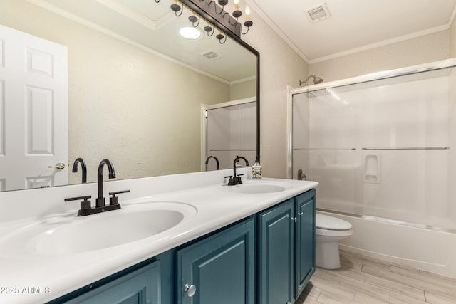 4801 E Quien Sabe Way, Cave Creek, AZ 85331 - bathroom featuring toilet, double vanity, crown molding, combined bath / shower with glass door, and wood finished floors