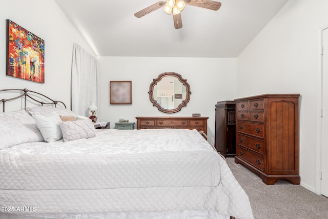 bedroom with light colored carpet, lofted ceiling, and ceiling fan