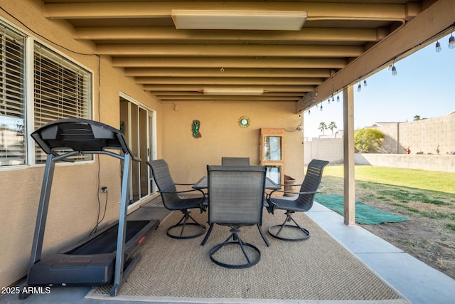 view of patio / terrace with outdoor dining area and fence