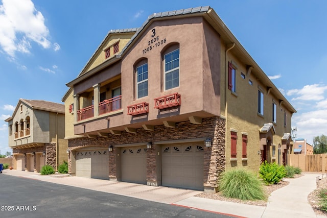 1350 S Greenfield Rd Unit 1005, Mesa, AZ 85206 - view of building exterior featuring a garage
