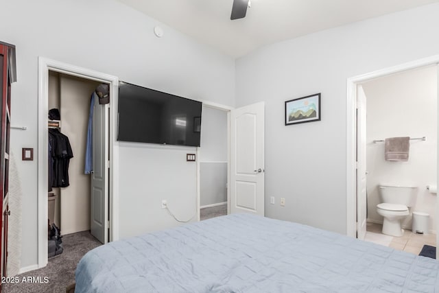 1350 S Greenfield Rd Unit 1005, Mesa, AZ 85206 - bedroom with a walk in closet, ensuite bath, a closet, a ceiling fan, and baseboards