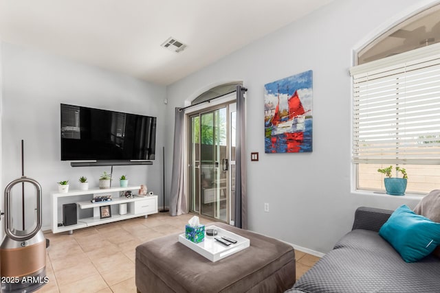 1350 S Greenfield Rd Unit 1005, Mesa, AZ 85206 - living room featuring light tile patterned floors and baseboards