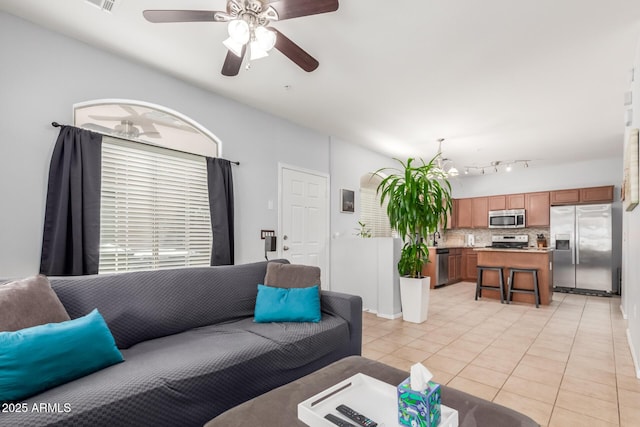 1350 S Greenfield Rd Unit 1005, Mesa, AZ 85206 - living room with light tile patterned floors and ceiling fan