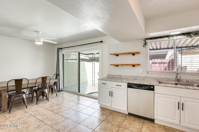 kitchen with dishwasher, ceiling fan, white cabinetry, and tasteful backsplash