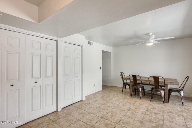 dining room with ceiling fan and light tile patterned flooring