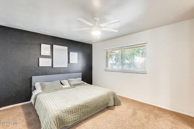 carpeted bedroom featuring ceiling fan