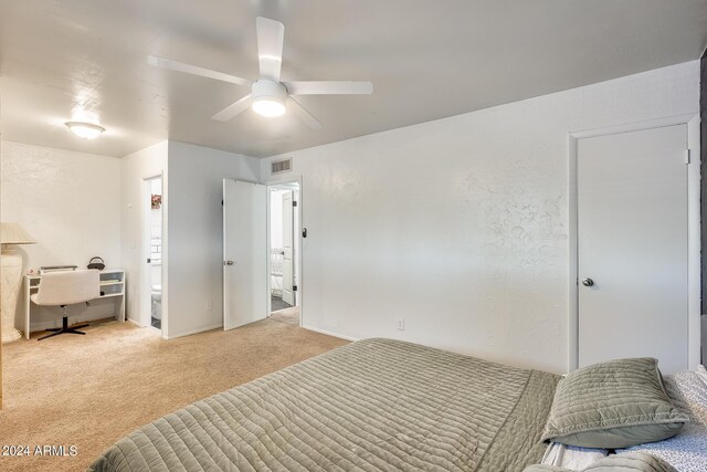 carpeted bedroom featuring ceiling fan and connected bathroom