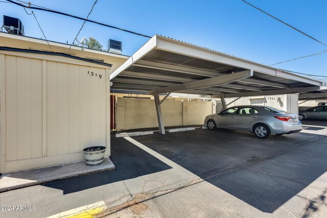 view of parking / parking lot with a carport