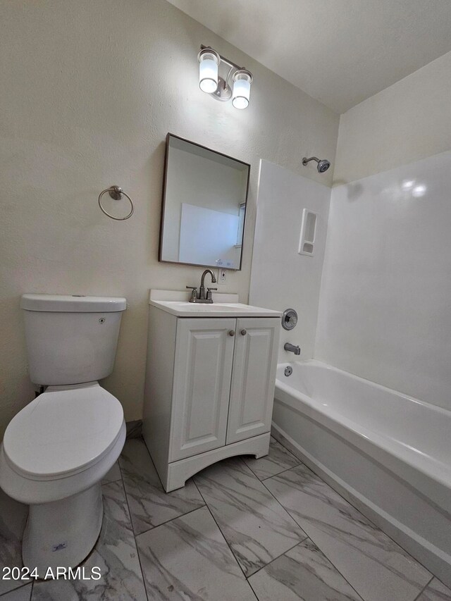 full bathroom with vanity, shower / tub combination, and toilet