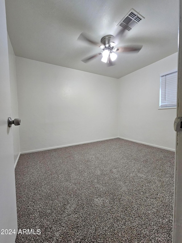 carpeted empty room with ceiling fan