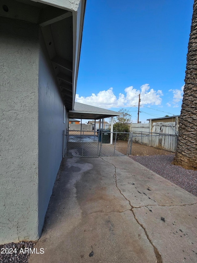 view of patio / terrace featuring a carport